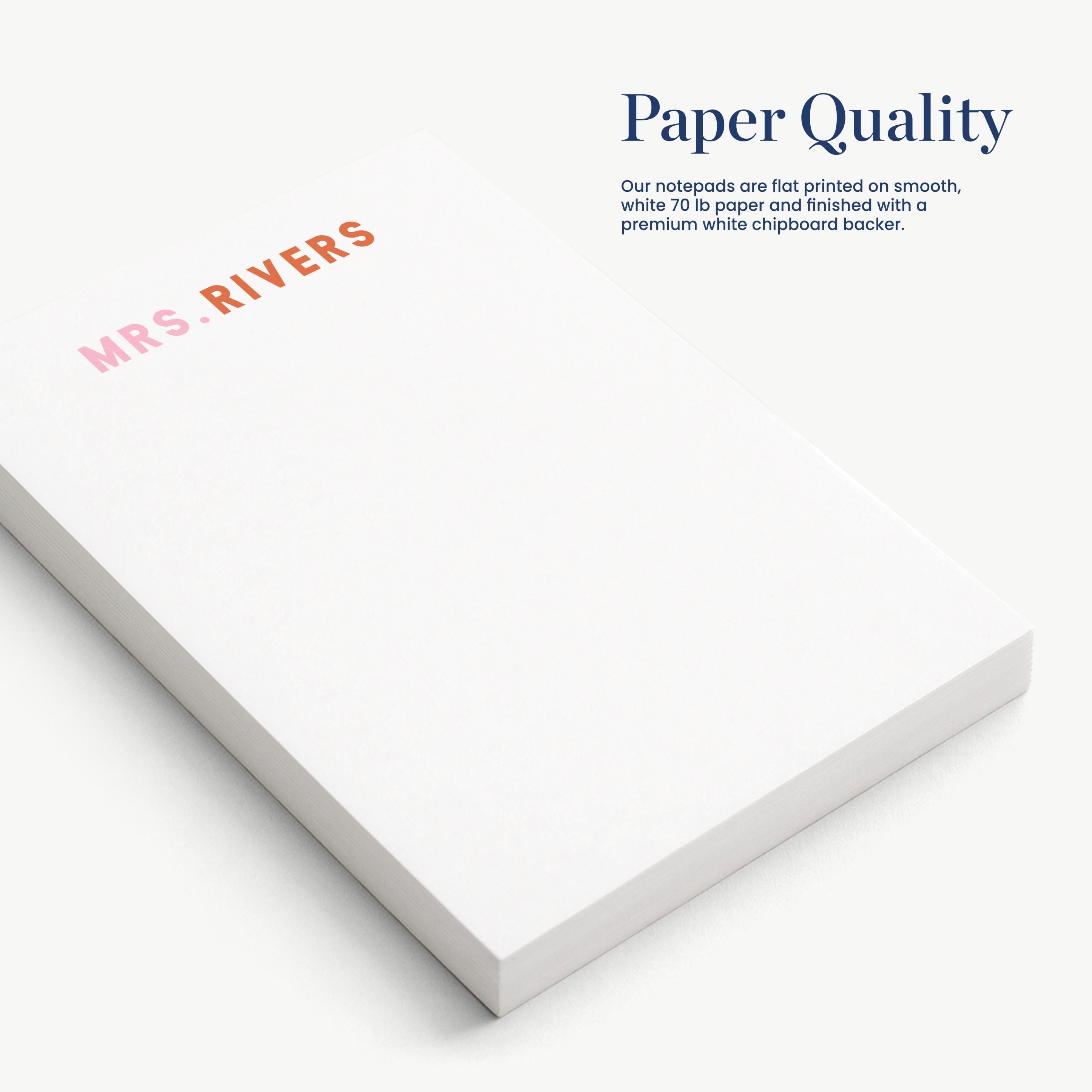 a close-up view of a white notepad with the text "Paper Quality" printed on it.