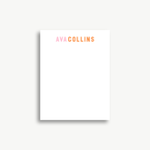 A white piece of paper with the text "AVA COLLINS" printed on it.